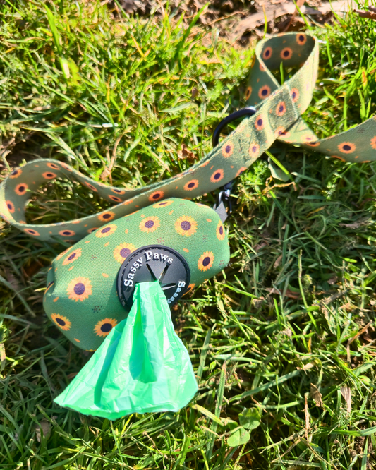 Green with little yellow sunflowers Sassy Paws Waste Bag Holder with black clip and matching lead or leash Black finishings