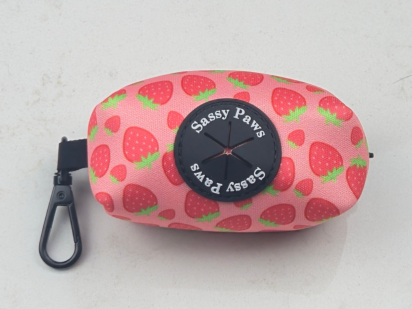 Pink, red with little strawberries Sassy Paws Waste Bag Holder with black clip